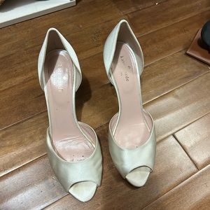 Kate Spade white satin heels.